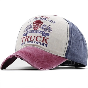 Detail of distressed brim and Ghost Rider print on vintage red white blue cotton cap