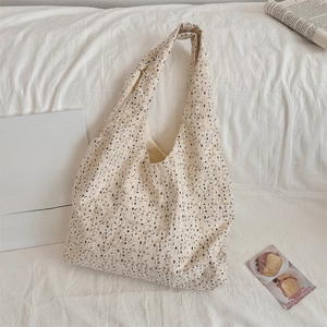 Floral canvas tote bag with bakery props in a minimalist lifestyle setting