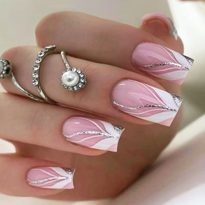 Detail of square french press-on nails with pink ombre, white waves and silver glitter