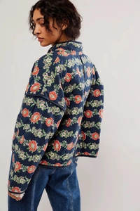Side view of floral quilted cotton jacket with vintage pattern and stand-up collar detail