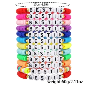 Vertical stack of colorful polymer clay bead bracelets with BESTIE letter charms