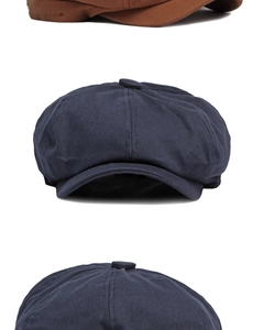 Detailed stitching and fabric texture of classic cotton newsboy caps in navy and brown