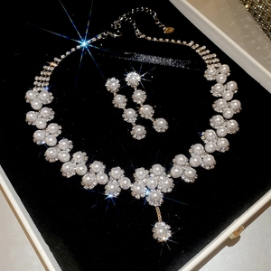 Exquisite floral jewelry set with white pearls and sparkling crystals in a gift box