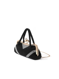 Detail of vintage black and white beaded clutch with gold frame and crystal clasp