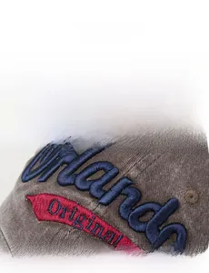 Detailed view of 3D Orlando embroidery on charcoal grey corduroy baseball cap texture