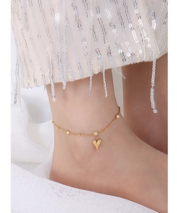 Close-up of 18k gold plated titanium steel anklet with a 3D heart pendant and zircons