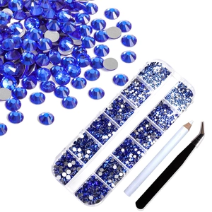 Macro view of dark blue glass rhinestones with 12-grid storage box and DIY tool set