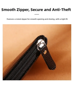 Close-up of smooth silver hardware zipper on black lychee pattern leather coin purse