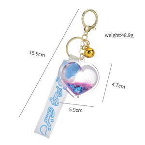 Heart quicksand liquid keychain with gold bell and blue 'Pretty Good' strap dimensions