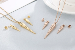 Detailed view of spiral cone jewelry sets in gold and rose gold stainless steel