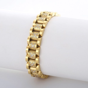 Hiphop gold watch link bracelet with CNC crystals on a white pedestal display