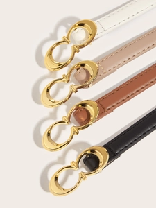 Detail of four thin leather belts in white, pink, brown, and black with gold metal buckles