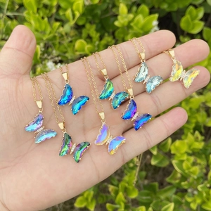 Polished butterfly crystal necklace in vibrant gradient colors with gold chain