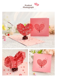 Macro shot of 3D pop-up cherry blossom tree greeting card with intricate laser-cut details