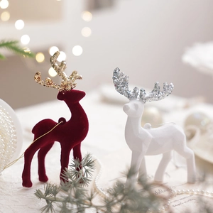 Pink and burgundy velvet Christmas reindeer figurines with glitter antlers for home decor