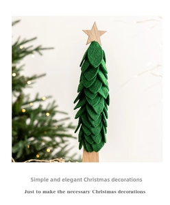 Minimalist green felt Christmas tree ornament with wooden star and stand detail