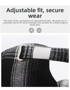 Detail of adjustable metal buckle and black grey plaid fabric on the baseball cap