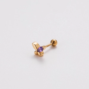 Macro detail of golden flower stud earring with purple marquise zircon and screw ball back