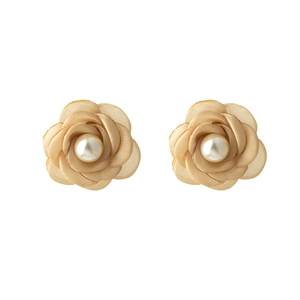 Detailed macro shot of elegant champagne lace rose earrings with central faux pearls