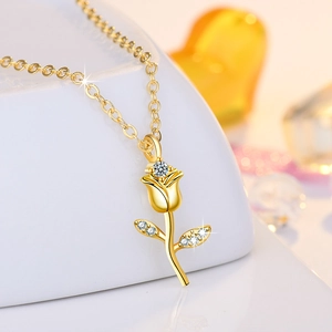 Vintage rose flower pendant necklace with zircon stone in gold finish on white stand