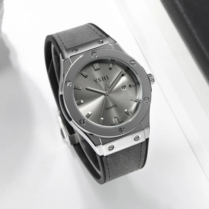 Detail of quartz watch with grey dial, calendar display, and grey suede rubber strap