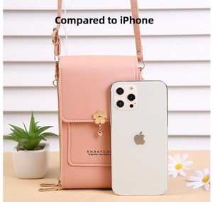 Detail of pink PU leather crossbody phone bag with gold floral pendant and zipper