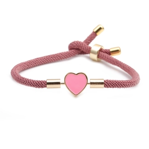 Pink braided rope bracelet with pink enamel heart and adjustable gold-tone slider