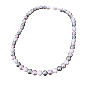 Elegant multi-colored pearl necklace featuring white, purple, and dark grey round beads