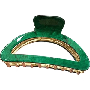 French minimalist green marble hair claw clip with golden metal spring on white background
