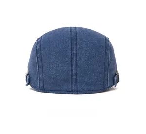 Rear view of vintage dark blue denim flat cap with adjustable copper metal buckle detail