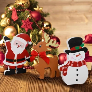 Three-piece wooden Christmas decor set featuring Santa, a reindeer, and a snowman figure