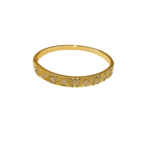 Elegant gold plated open bangle with sparkling zircon flower charms and textured finish