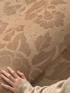 Close-up of vintage floral jacquard fabric texture on a waterproof round area rug