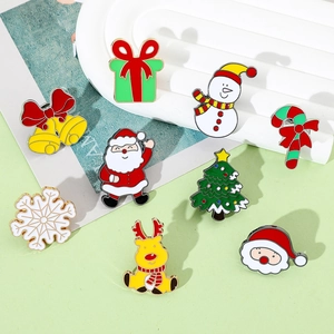 Detailed view of a 9-piece Christmas enamel brooch set featuring Santa, reindeer and snowman