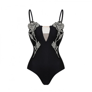 Black one-piece swimsuit with spaghetti straps and 3D rhinestone rose decorations