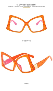 Close-up of butterfly frame glasses in orange leopard tortoiseshell with pink inner temples