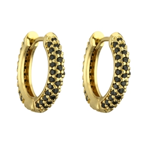 Detail of gold huggie earrings featuring triple-row black pavé-set gemstones in gold