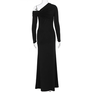 Detail of elegant black off-shoulder knit evening dress with pleated bodice and fishtail hem