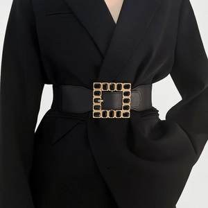 Black elastic waist belt for women with large gold square buckle and black gemstones