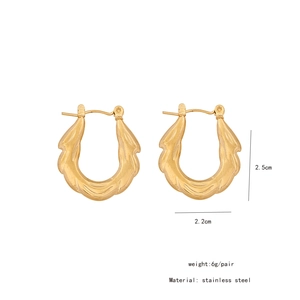 Detailed macro view showing the 2.5cm x 2.2cm dimensions of golden stainless steel earrings