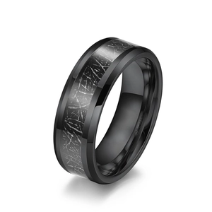 Men's black tungsten ring featuring a silver meteorite inlay with geometric texture