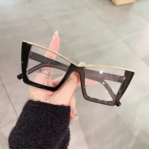 Modern black cat-eye glasses with gold metal bridge trim and vintage oversized frame
