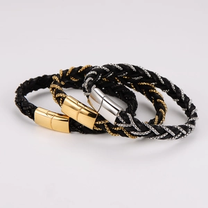 Detail of woven leather bracelets for men featuring magnetic metal clasps and chain wrap