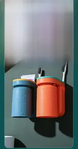 Waterproof wall-mounted toothbrush holder with navy and orange cups for bathrooms
