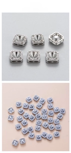 Macro detail of silver square zircon ear stud base with sparkling CZ micro-pave setting