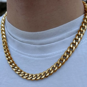 Hip hop style gold-plated stainless steel Cuban link necklace worn by a model