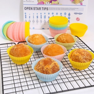Colorful silicone baking cups for muffins on cooling rack with assorted vibrant colors