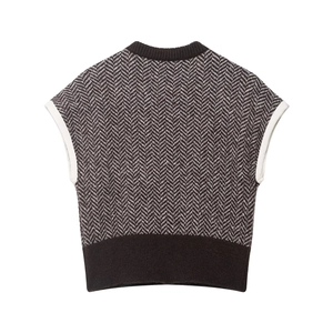 Vintage herringbone knit vest with deep brown ribbed trim in retro layering style