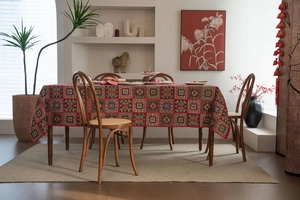 Close-up of red jacquard tablecloth with festive geometric and floral patterns