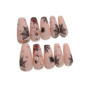 Set unghie finte Halloween con zucca arancione e decorazioni a ragnatela nera